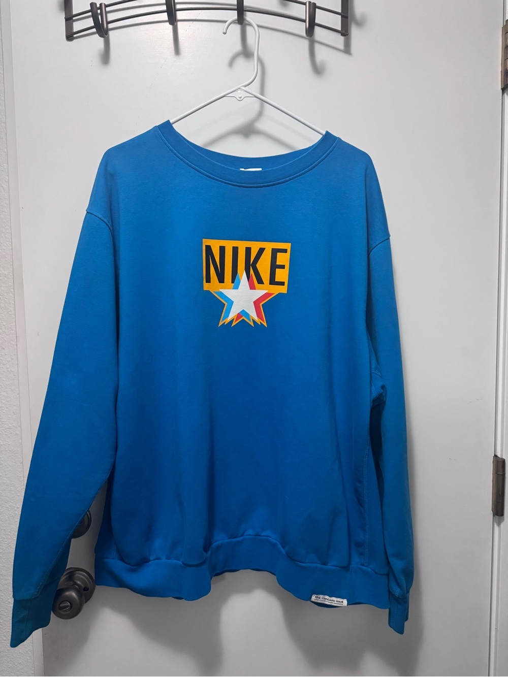 Nike Blue Crewneck Sweatshirt with Multicolor Star Logo